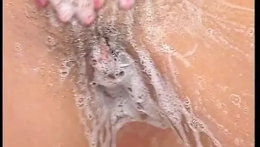 Hairy MILF slut masturbates under shower