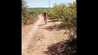 Walking naked in field