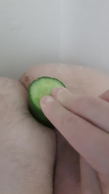 Boy experimenting with cucumber