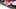 Pregnant MILF in Little Red Dress Pulled up with Black Fishnets taking Large Dildo in ass mounted on Wall