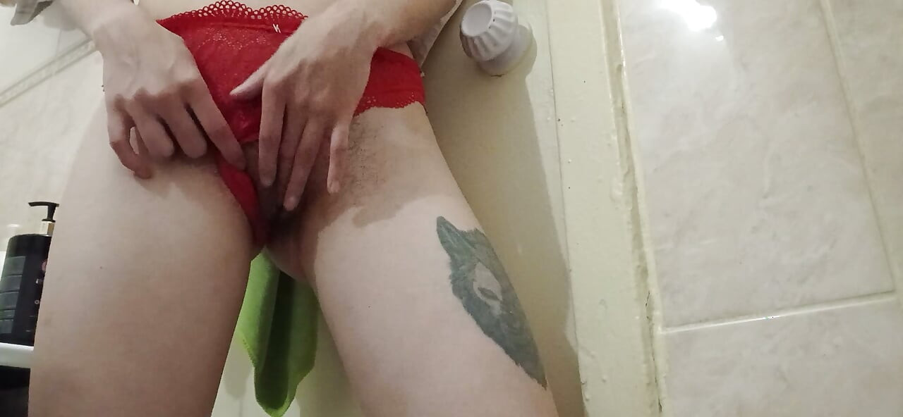 A skinny student girl in red panties masturbates her hairy pussy