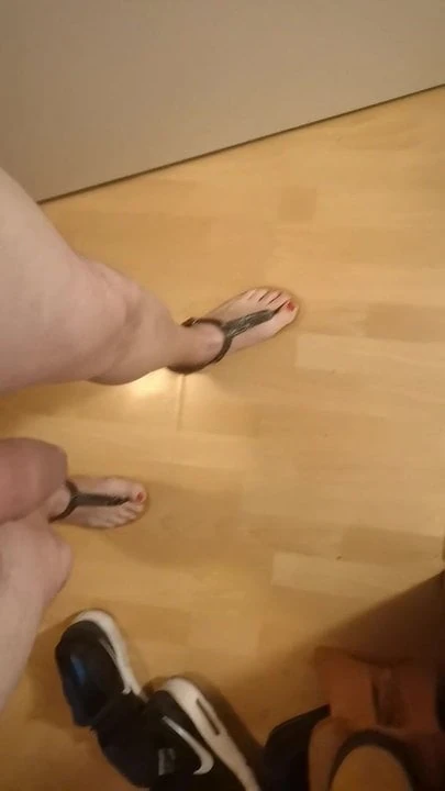 with toe separator sandals naked in the staircase