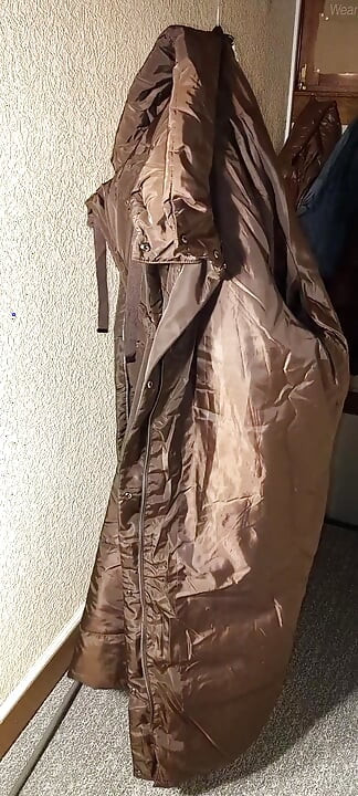 Fucking the shiny lining of a long brown lady wintercoat