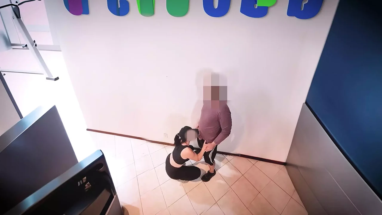 Personal Trainer plays with his friend’s cock in the back of the gym.