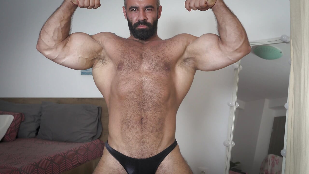 Handsome hot hunk flexing muscles and jerking uncut thick cock until he cums - Anthony Beau