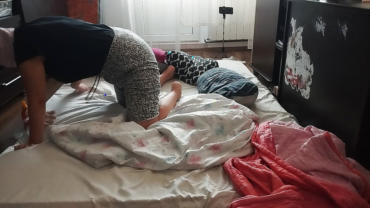 Sensual massage of a hot amateur couple with oil on the body.