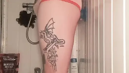 Skinny tattooed boy in shower playing with his dildo