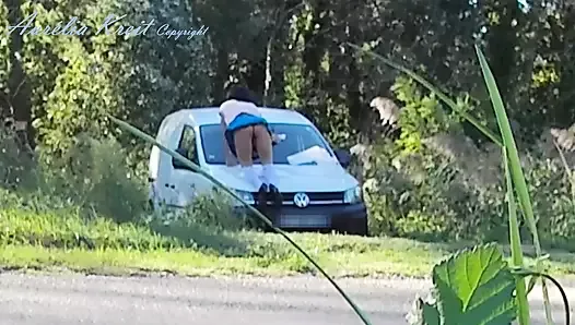 Outdoor car windows cleaning by the road