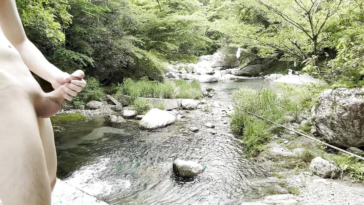 Naked masturbation in a clear stream