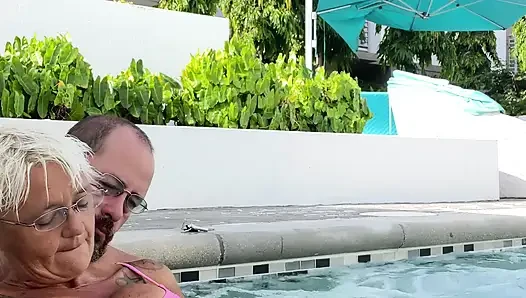 Getting frisky in the hot tub. Boob play.