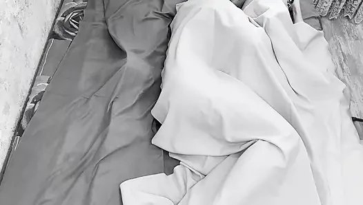 Couple caught on camera having sex in bed .