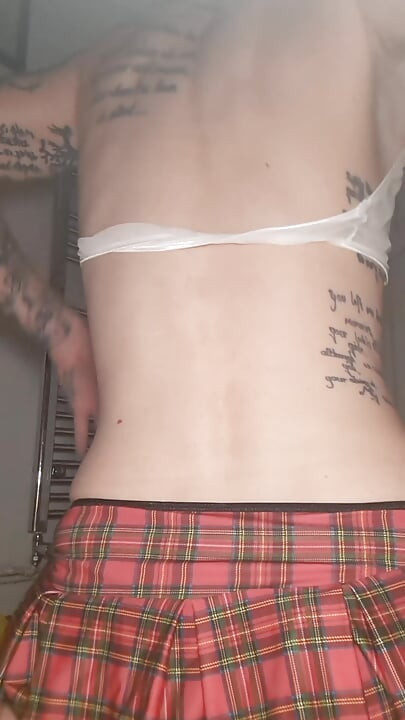 Tattooed sissy riding dildo in bathroom