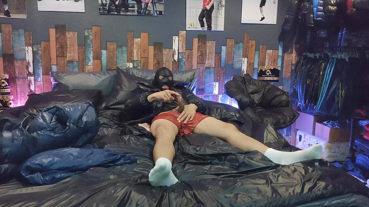 Cock Rubbing Down Jacket on Shiny Nylon Bed