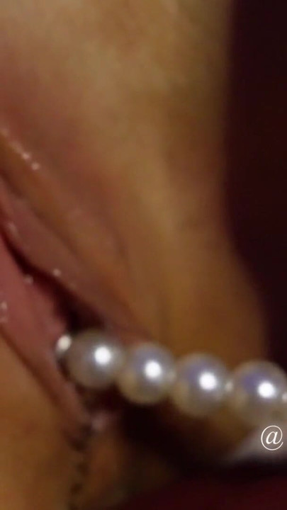 Sensual masseuse slow striptease and pulling anal pearls out of tight pussy close up | Clip 1