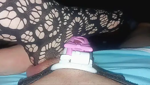 Playing with hubby in his pretty pink ribbon chastity.