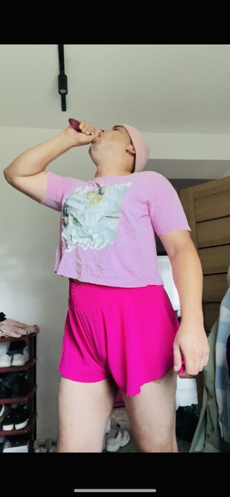 sissy in pink fucks her mouth with a dildo