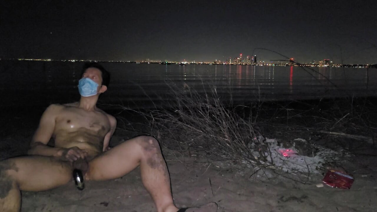 oiled masturbating and piss on the nude beach at night