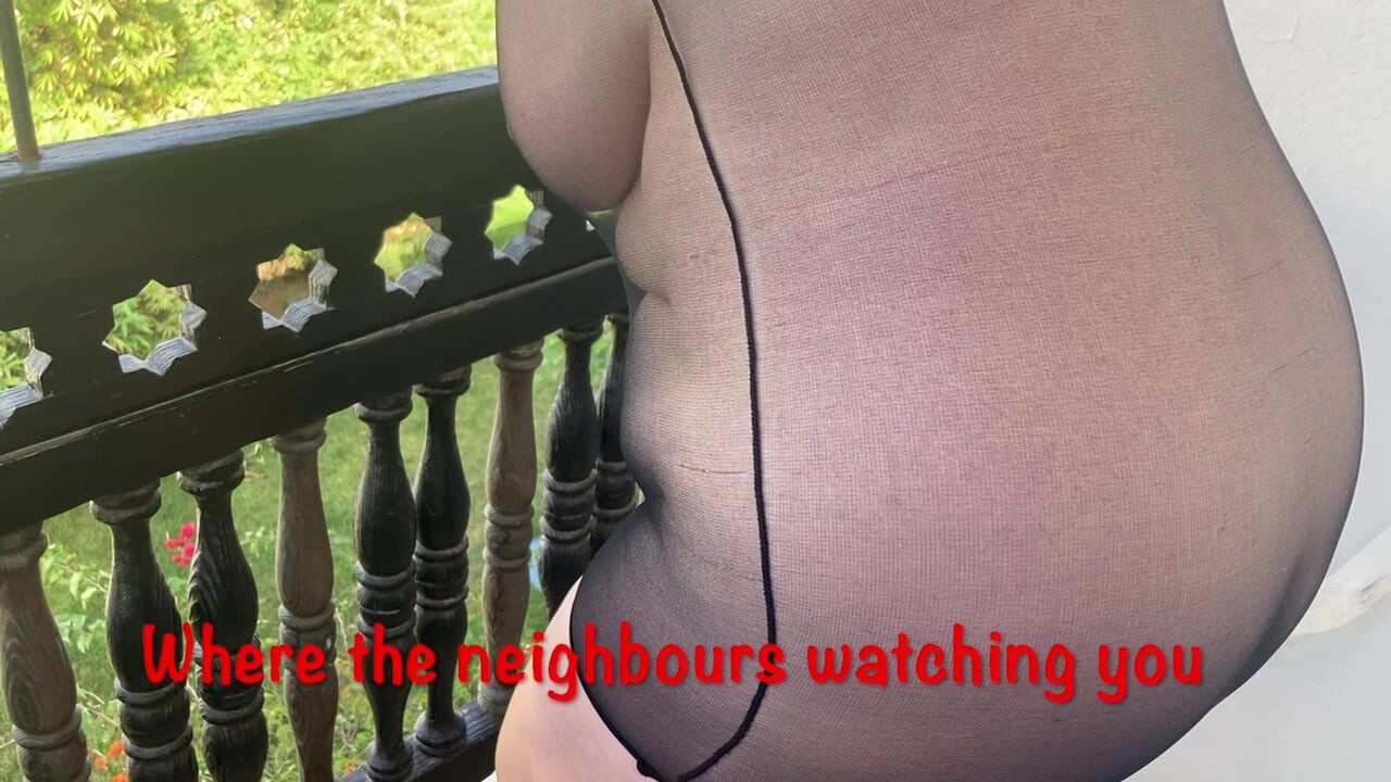 Mrs Mature Feet on the balcony in a very sheer dress