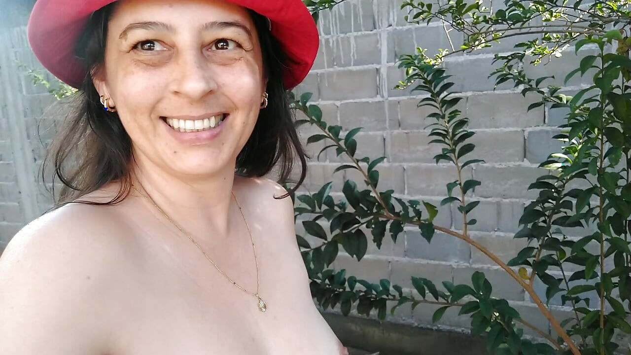 My wife is masturbating naked in the front yard.