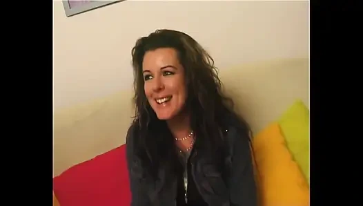 Beautiful and Shy Brunette Undresses in Front of a Camera