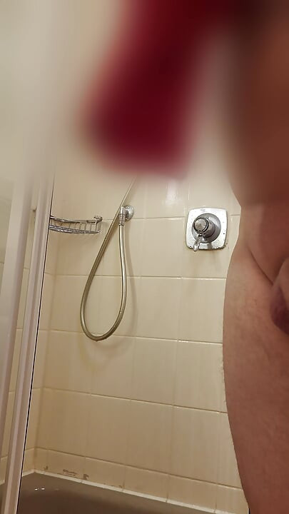 Guy showering in hotel