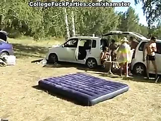 Lewd couple of naked students fucking in the tent