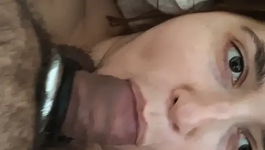 Sitting on top of me, he fills my greedy mouth with his thick cock that I swallow up to the balls while watching him