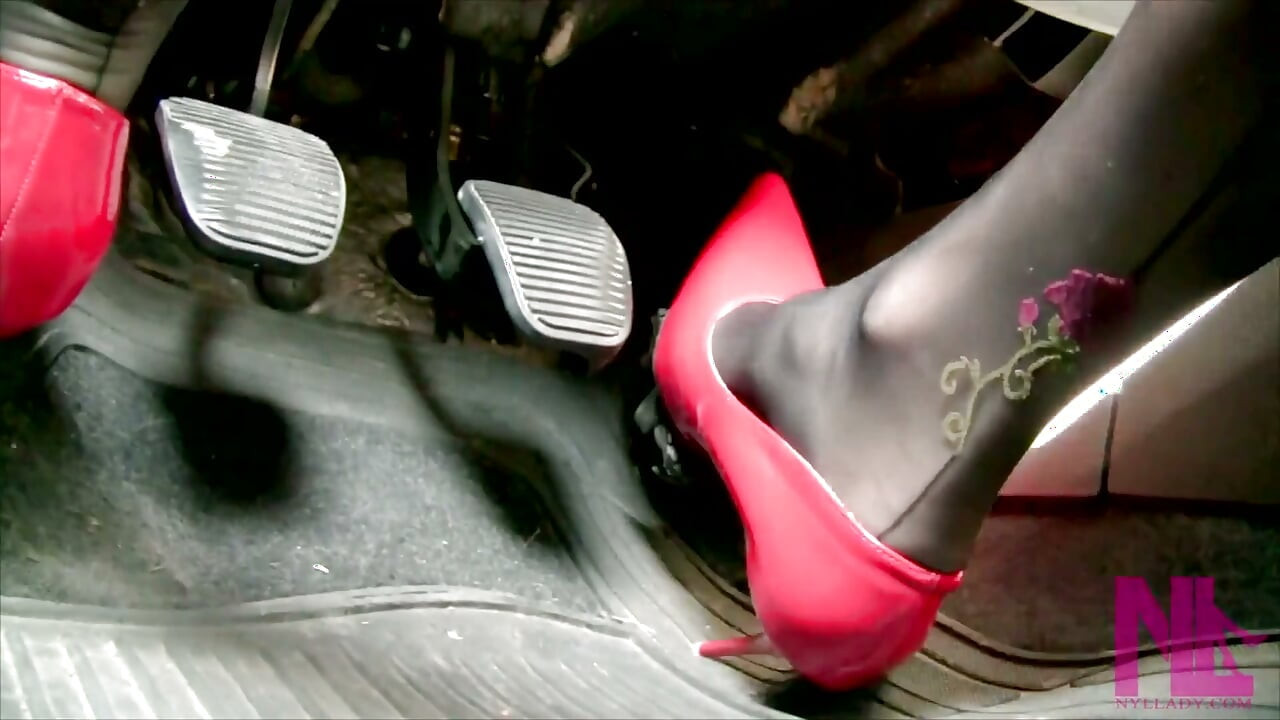 Driving in Scarlet Patent Pumps and Phillipe Matignone Rosed Stockings