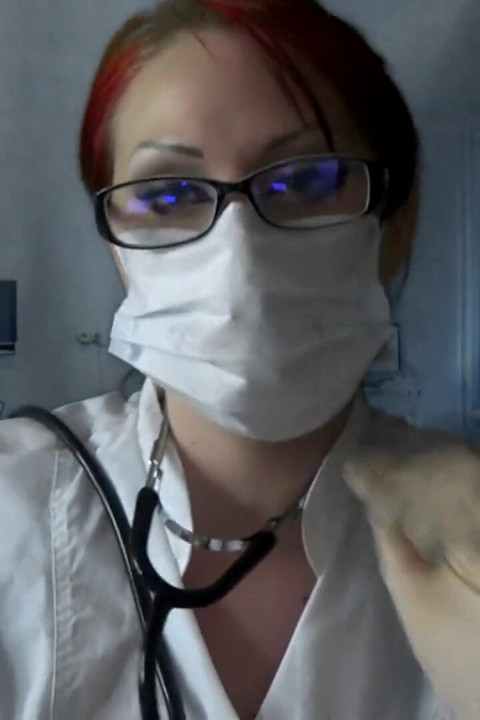 Doctor eating in medical mask and gloves