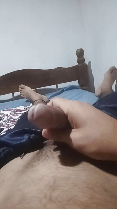 Man lying down masturbates while his neighbor is softening with his wife