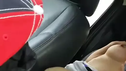 Husband films wife and friend in back seat