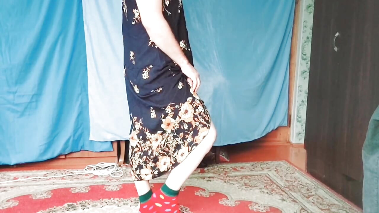 Lovely femboy in plaid skirt skipping down street