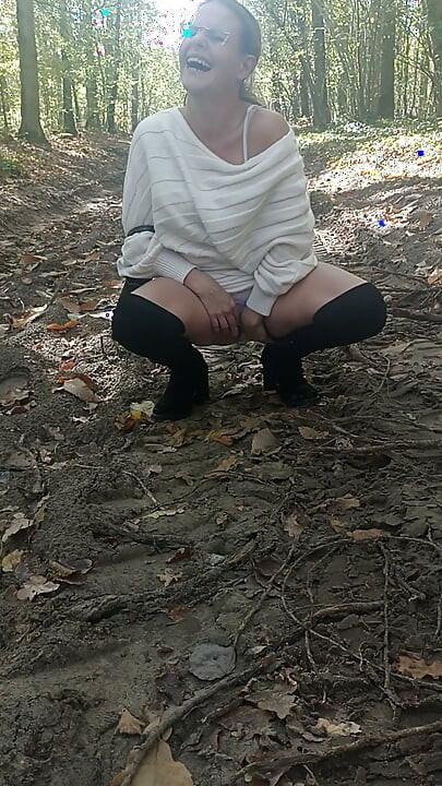 Slut Jade in the wood shows off in front of voyeur