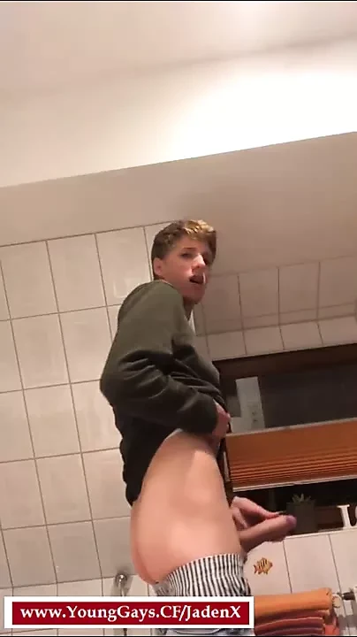 A gay man from Germany jerks off his big dick in the bathroo