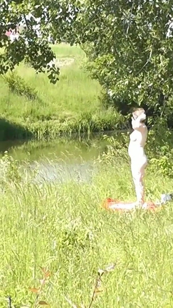 Thrilling moment from "Milf sexy woman sunbathing naked on river bank. Naked in public. Wild beach Nudist. Ass. Pussy."