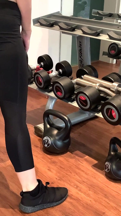 Business woman trains in gym to stay fit