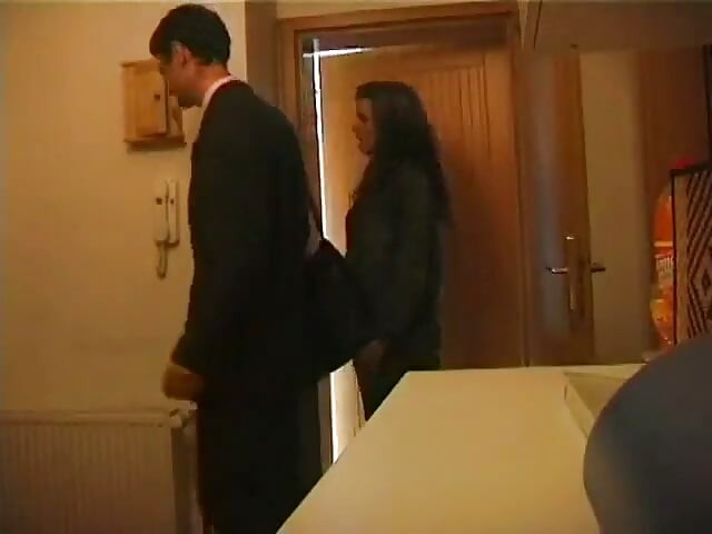 Beautiful young brunette gives her boyfriend a back massage