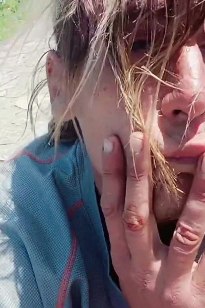 Sexy Guy on the Beach Clearing a Little
