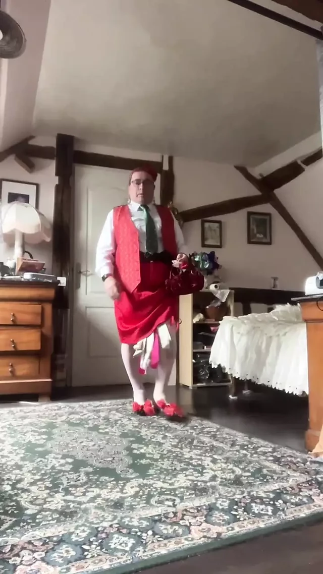 In outfit with a skirt and a red vest for a night out