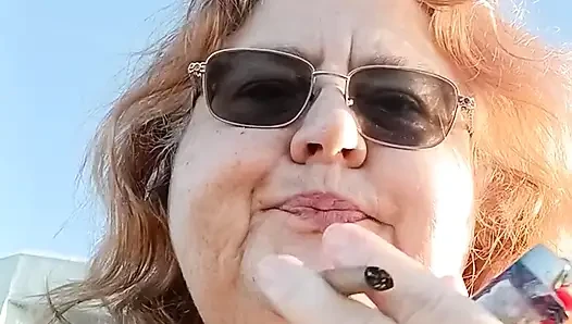 Bearded Lady try's to  lights  on windy beach!