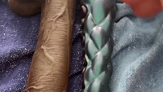 The latex titty slut pushes three monstrous dildos in a row!