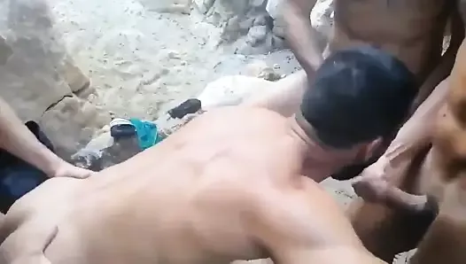 Muscle slut in groupsex on beach