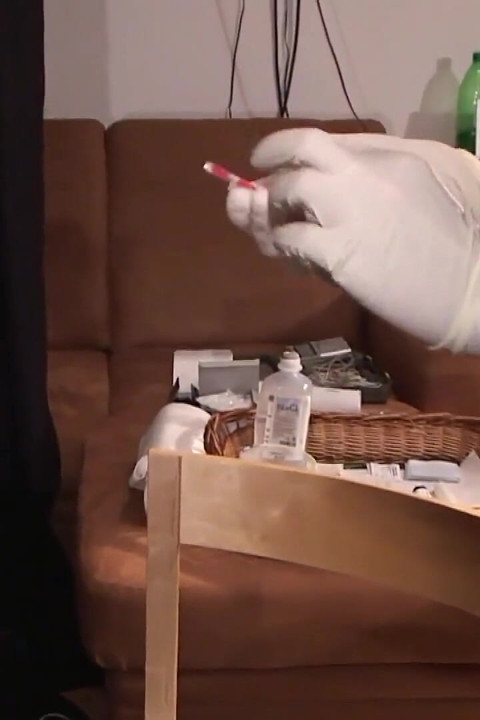 MILF lies on the bed as pussy gets injected wit syringes