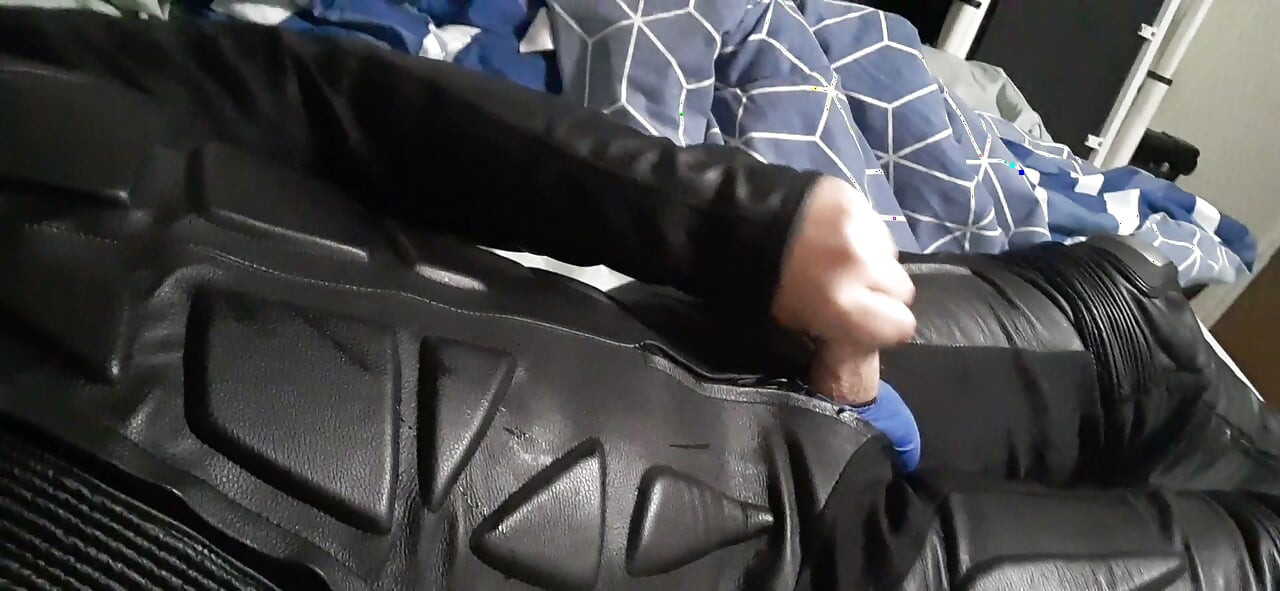 Biker cums in leather moto race suit