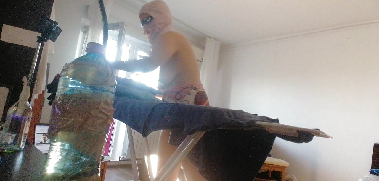 Amateur wife doing housework naked. Sexy and naughty wife trying on clothes that she cuts.