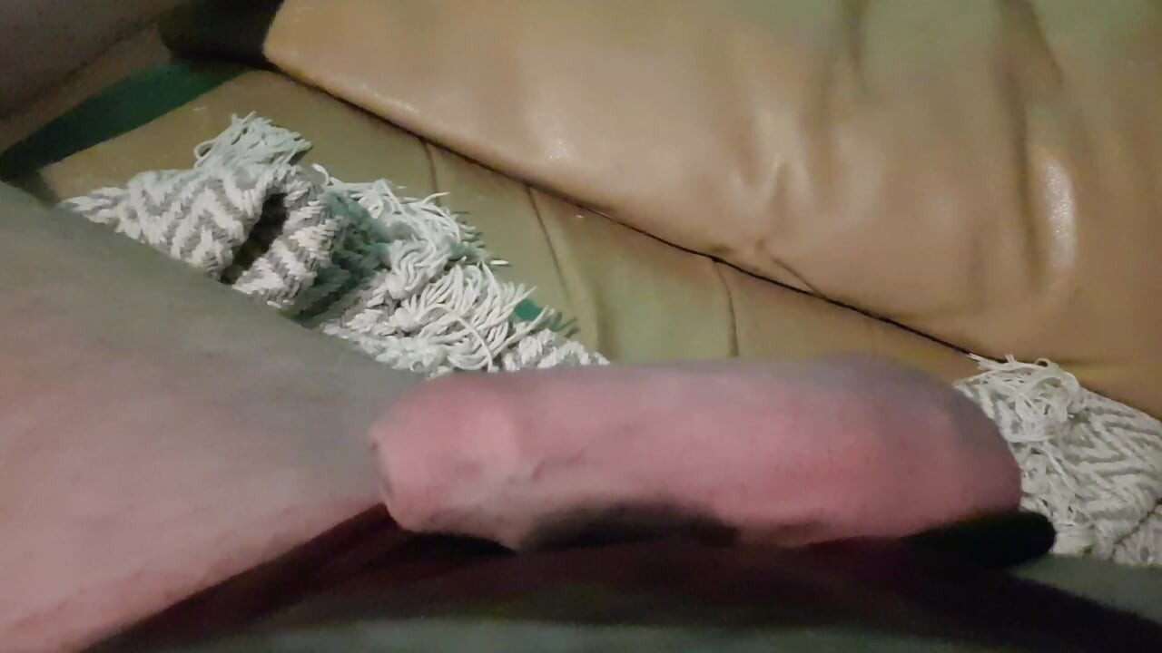 My Friend Is Lying on the Sofa in the Wet on a Wet Little Hole, He Jerks off His Cock