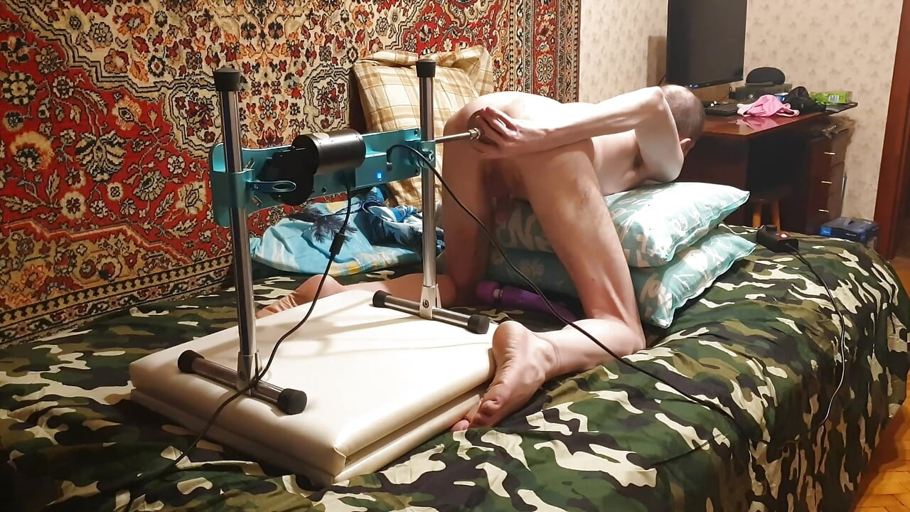 Hot gay having sex with a fuck machine