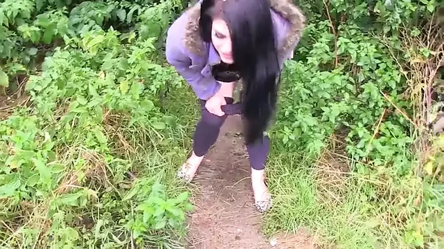 Busty brunette gets picked up before pissing outdoors