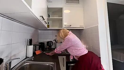 Hottest blonde in a lace miniskirt flashes her beautiful round sexy ass and legs under her short skirt in the kitchen