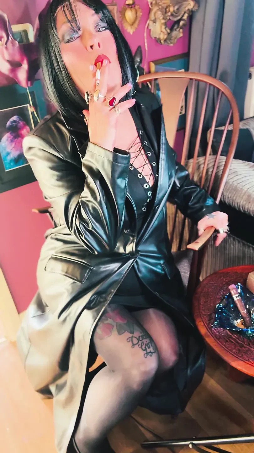 Your Favourite Smoking Queen Dressed In A Full Length Leather Coat, Pantyhose & High Heels Smokes A Cork 100 Cigarette For You